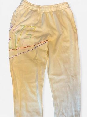 Nike soft yellow sweatpants with large multicoloured Logo. Size: L #sweatpants